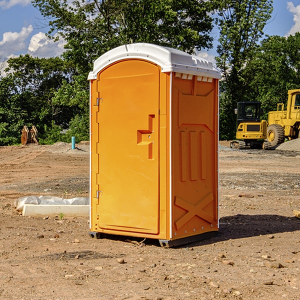 what is the cost difference between standard and deluxe portable restroom rentals in Vanduser